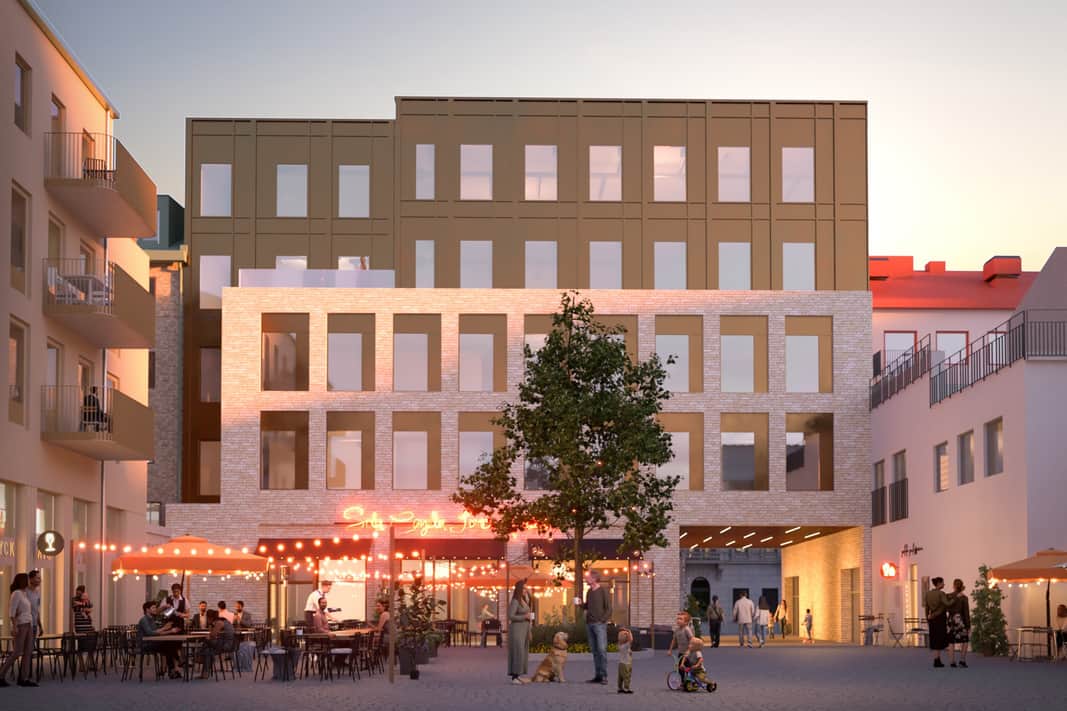 Det nya kontorshuset i ljust tegel med restaurang i botten och takterass högst upp