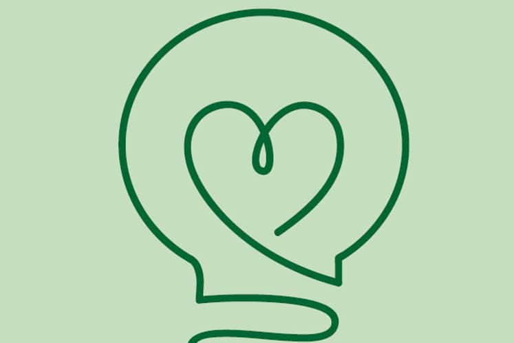 Illustration av glödlampa med ett hjärta i.