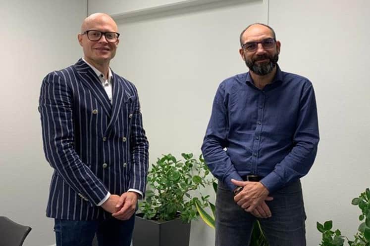 Porträtt av Kristian och medarbetare.